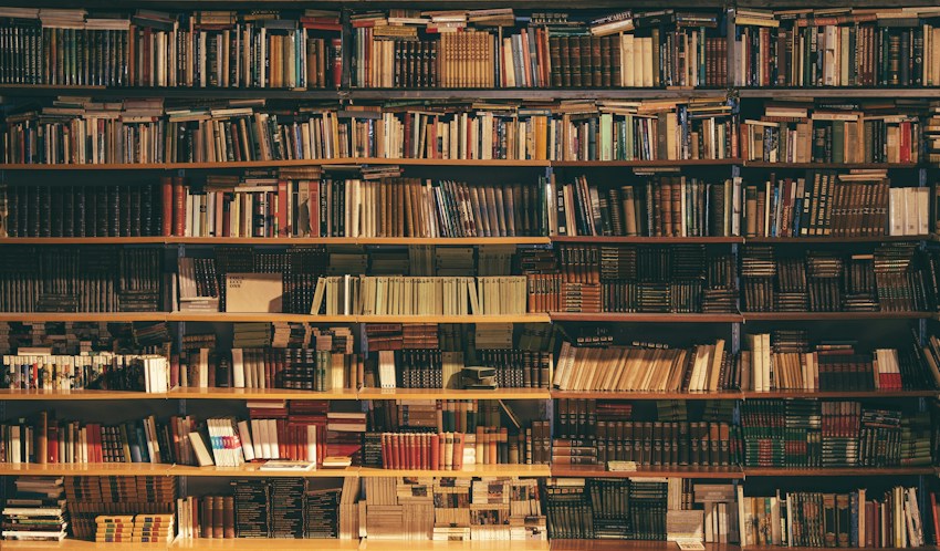 Tall shelves filled with books in a library