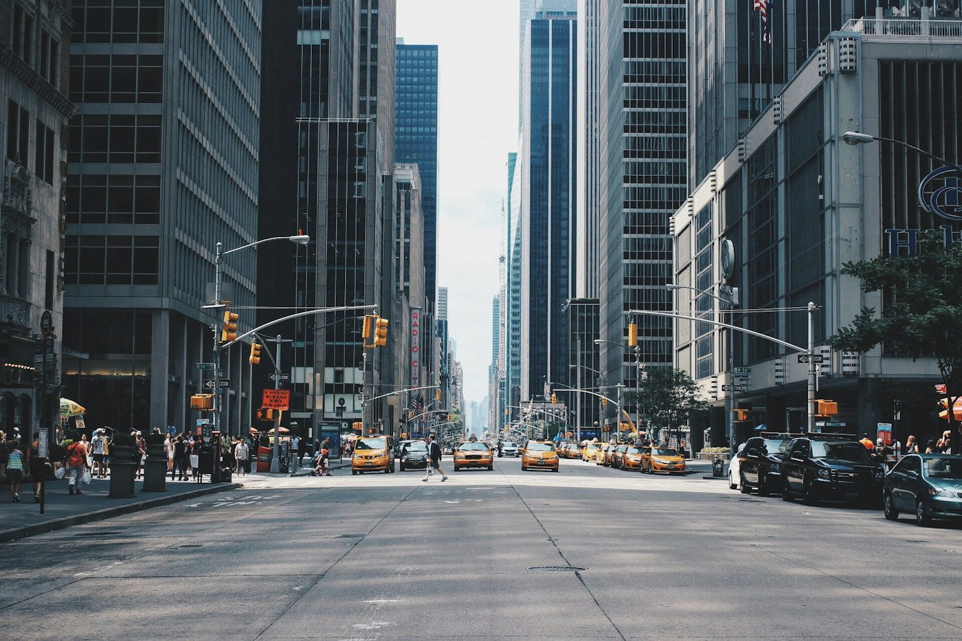 A busy city street lined with tall buildings