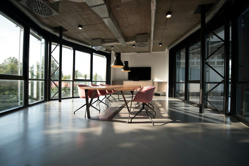 A calm workspace with a desk beside a window